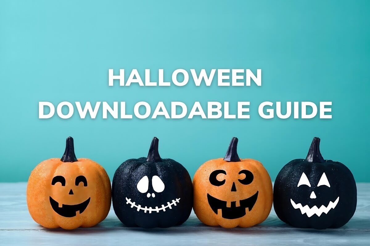 Small carved orange and black pumpkins with Halloween Downloadable Guide text